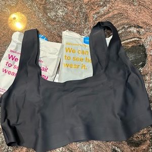 Women’s Parade bras. Two bras - 1 black and 1 green. Both are brand new. Size 3x